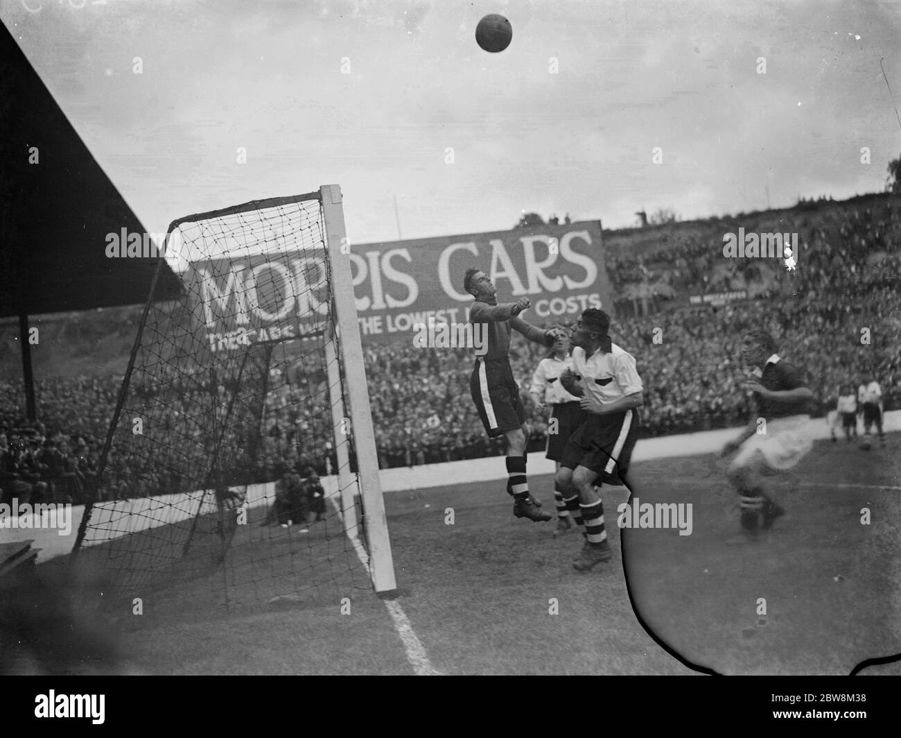 Football match ; Goalkeeper makes a save . 1935 Stock Photo