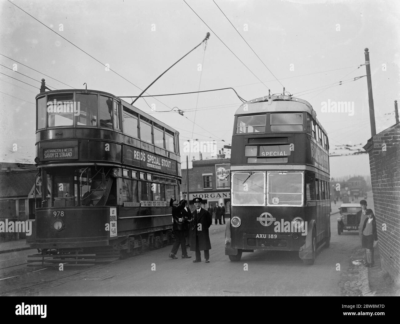 Trolley bus and tram , Welling , South East London . 1935 Stock Photo
