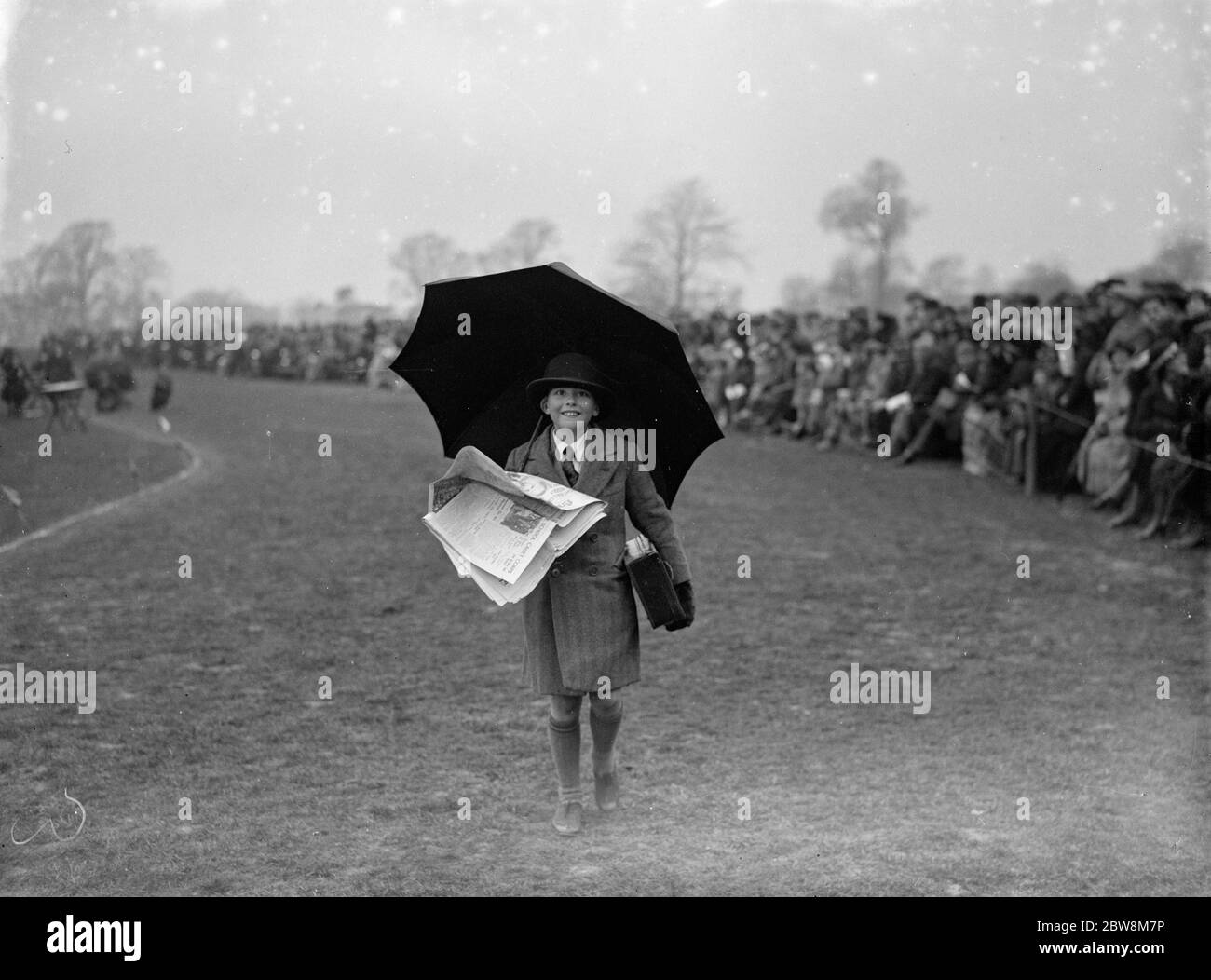 A boy competitor in an umbrella race . 1935 Stock Photo