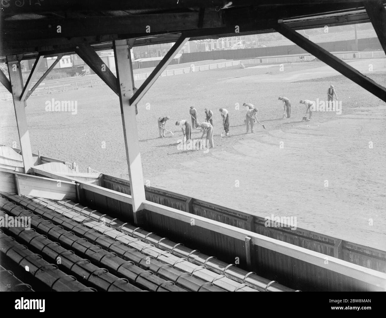 Northfleet United - Relaying the pitch at Northfleet United's Stonebridge Road ground. - 1935 Scene from the spectator stands , workers on the pitch at the Northfleet football ground . 1935 Stock Photo