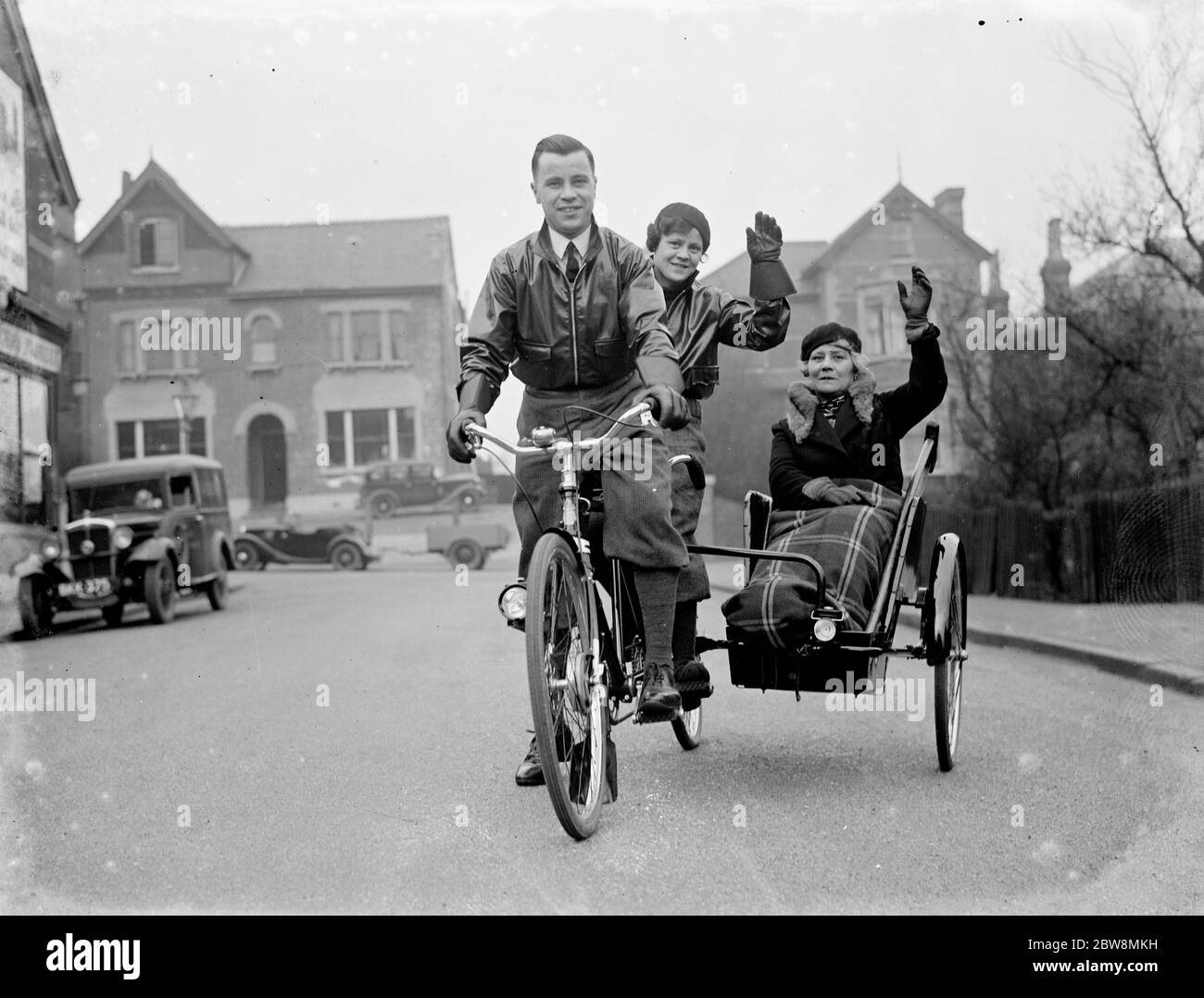Mr Simmonds riding his tandem bicycle with a sidecar . 1936 Stock Photo