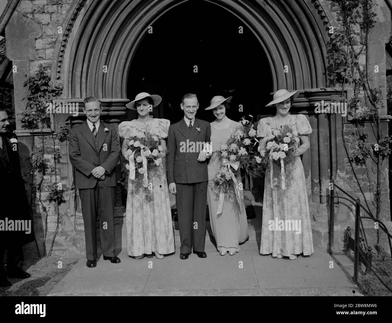 Wedding of A Newman Goss and J Lester . The couple with the bridesmaids and Best Man . 16 October 1937. Stock Photo