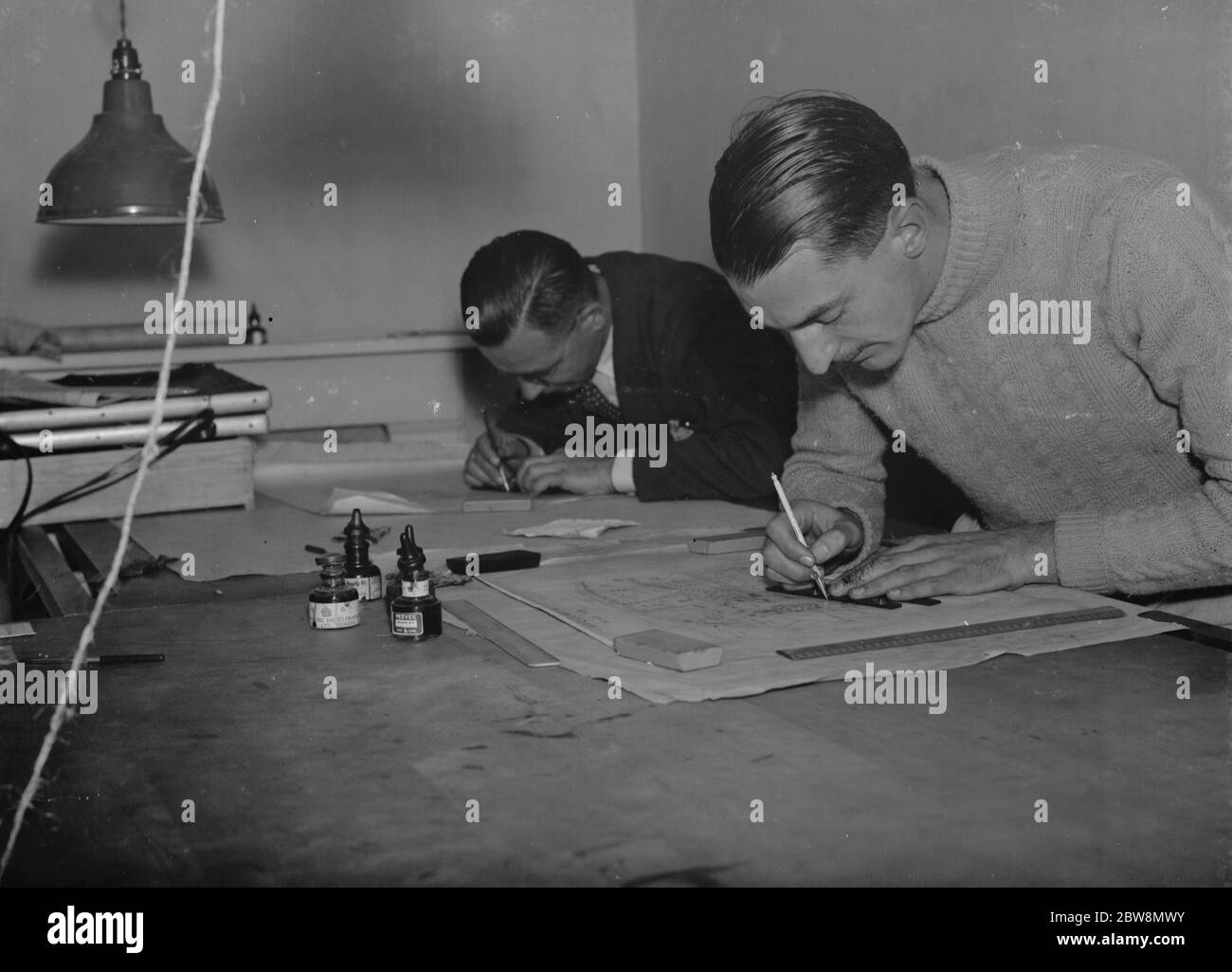 Students tracing maps for the benefits of surveying them . 1937 Stock Photo