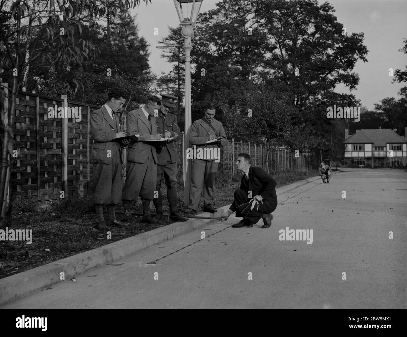 Students receiving chain instruction on surveying and measuring distances from the Army . 1937 Stock Photo
