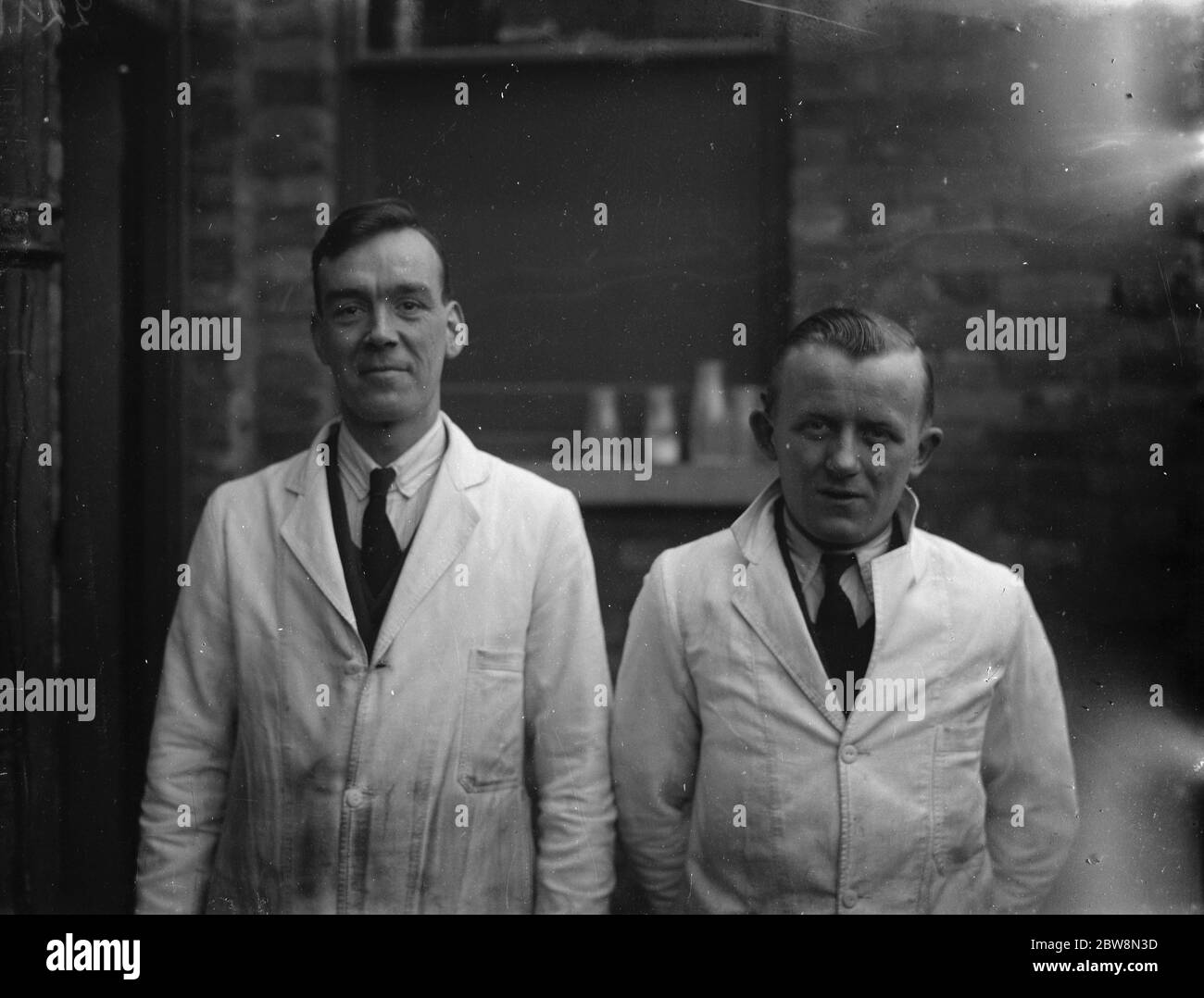 Mr Hughes and his assistant 1935 Stock Photo Alamy