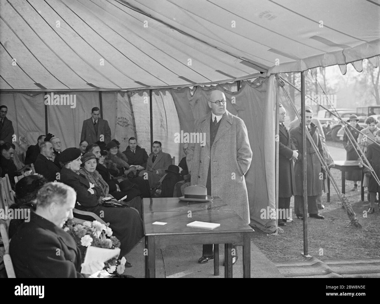 Opening of the St Bartholomew ' s and the Royal London Hospitals FC ' s new sports pavilion in Foxbury . W Girling Ball speaking to the crowd . 1937 Stock Photo