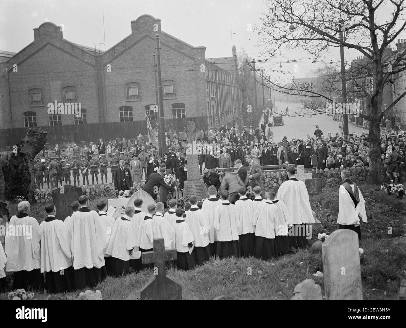 The laying of wreaths around the war memorial at the Erith Armistice memorial service . 1937 Stock Photo