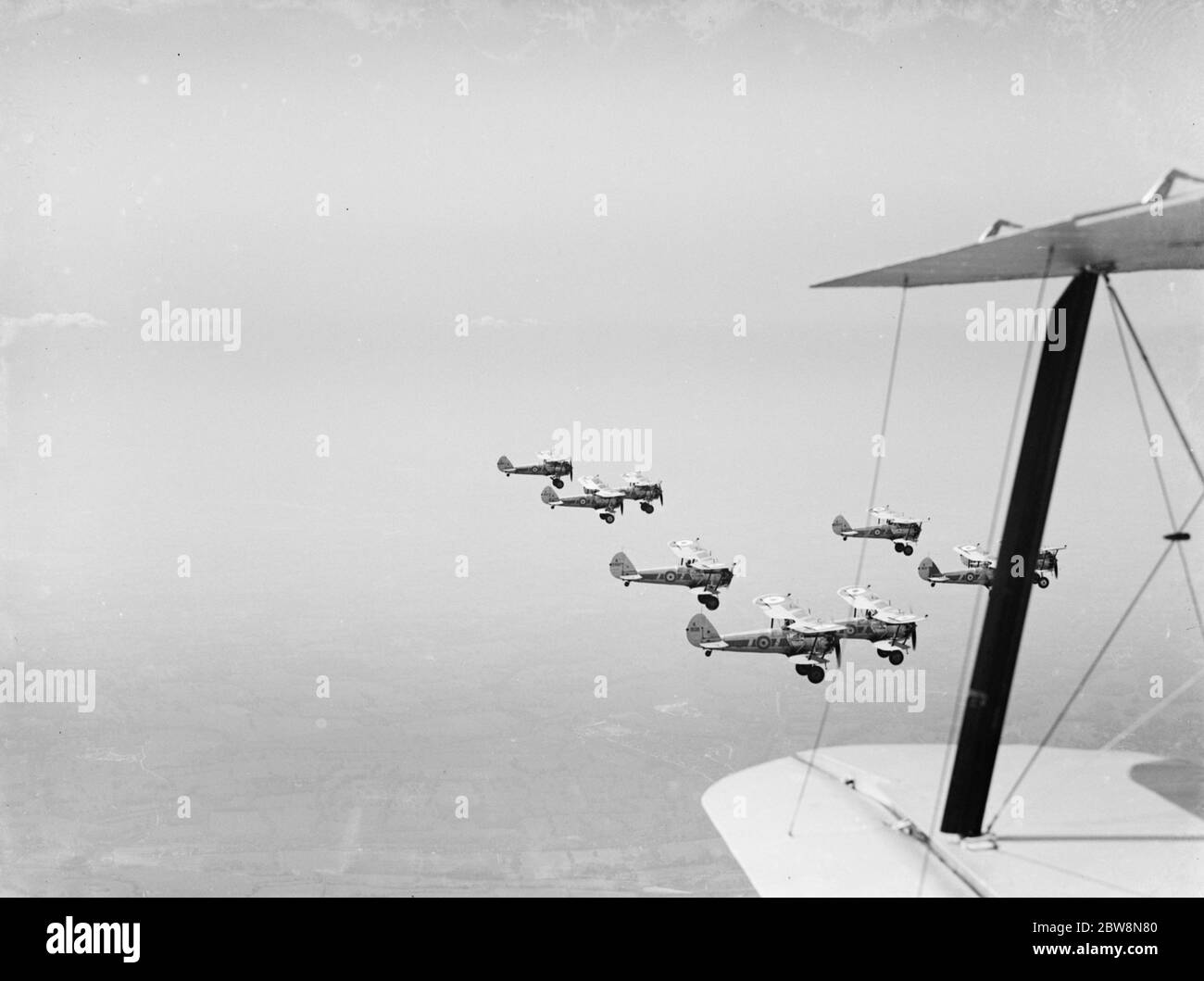 Bristol Bulldogs fighters of No 32 Squadron in formation flying over Biggin Hill . 1936 Stock Photo