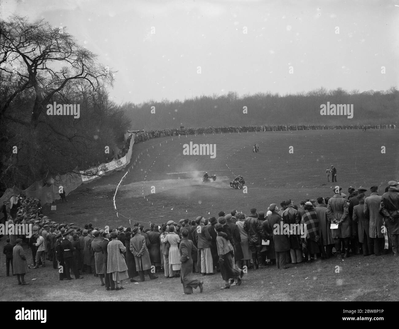 A general view of Rochester speedway track with two sidecar mounted bikes taking the bend . 1936 Stock Photo