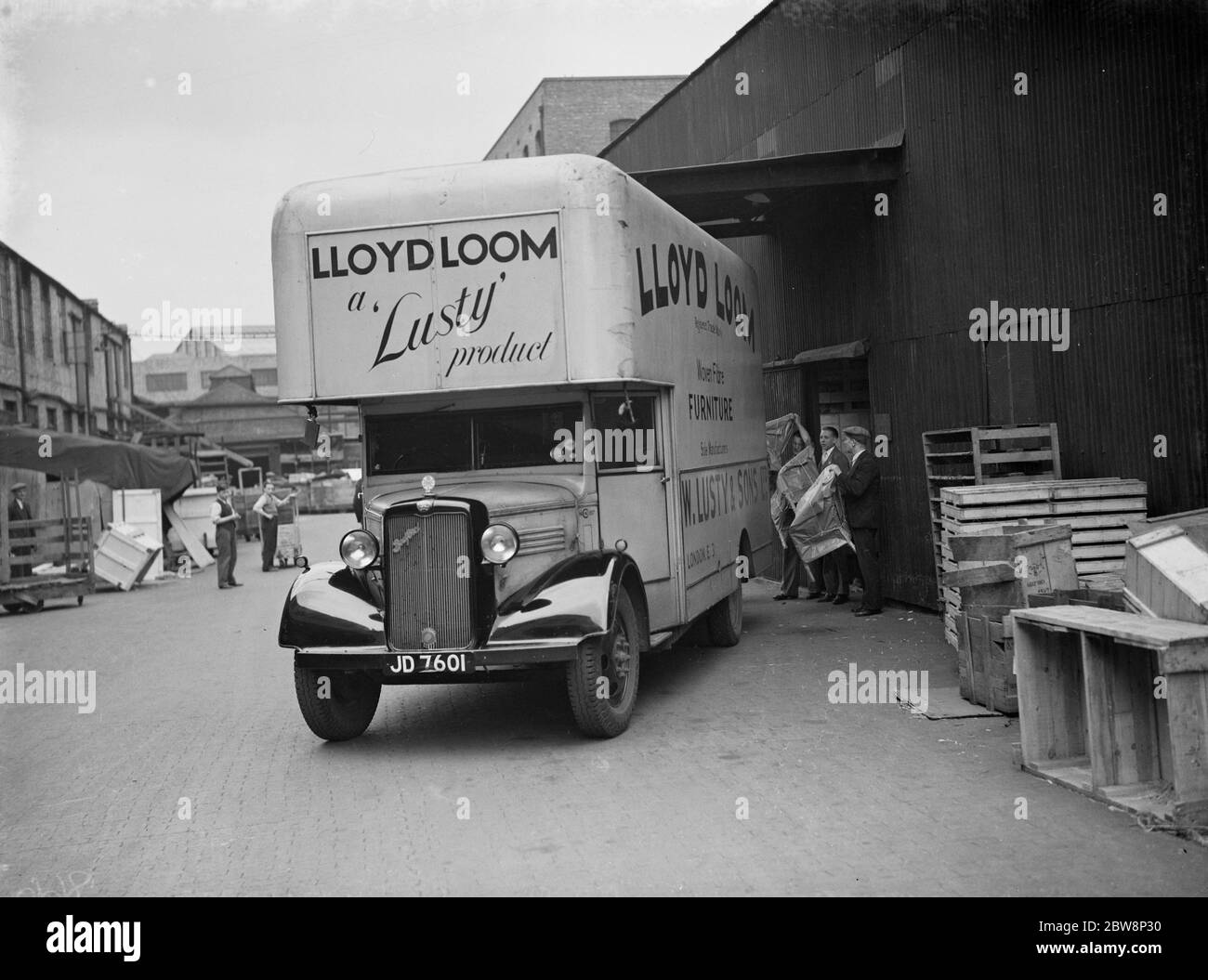The forecourt of Lloyd loom , lusty furniture produce factory , A Bedford lorry being loaded for