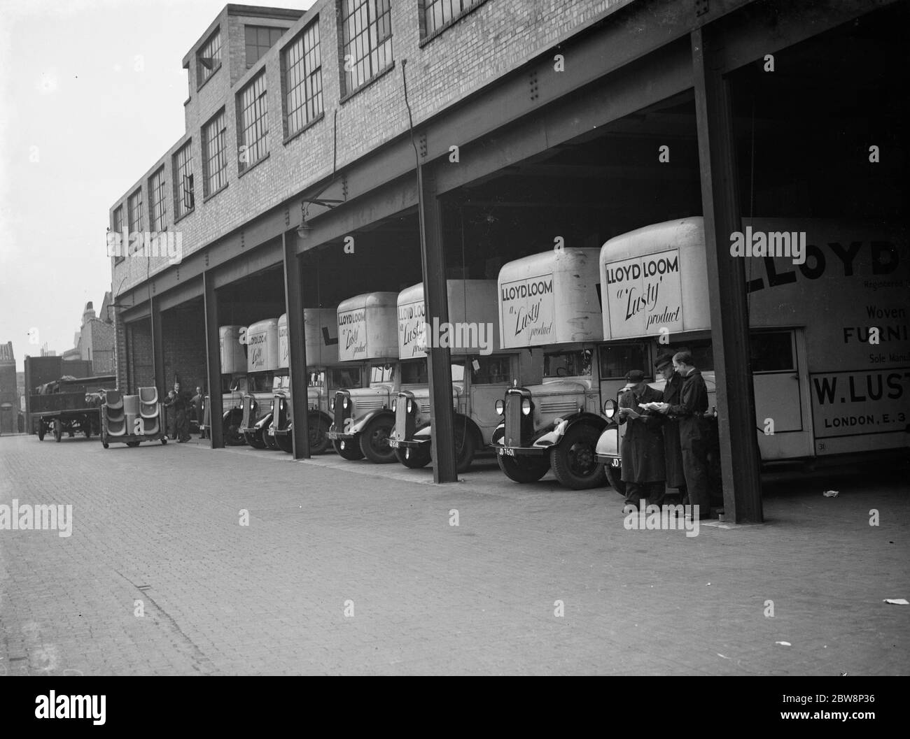 The forecourt of Lloyd loom , lusty furniture produce factory , The Bedford lorrys wait for the jobs . 1938 Stock Photo