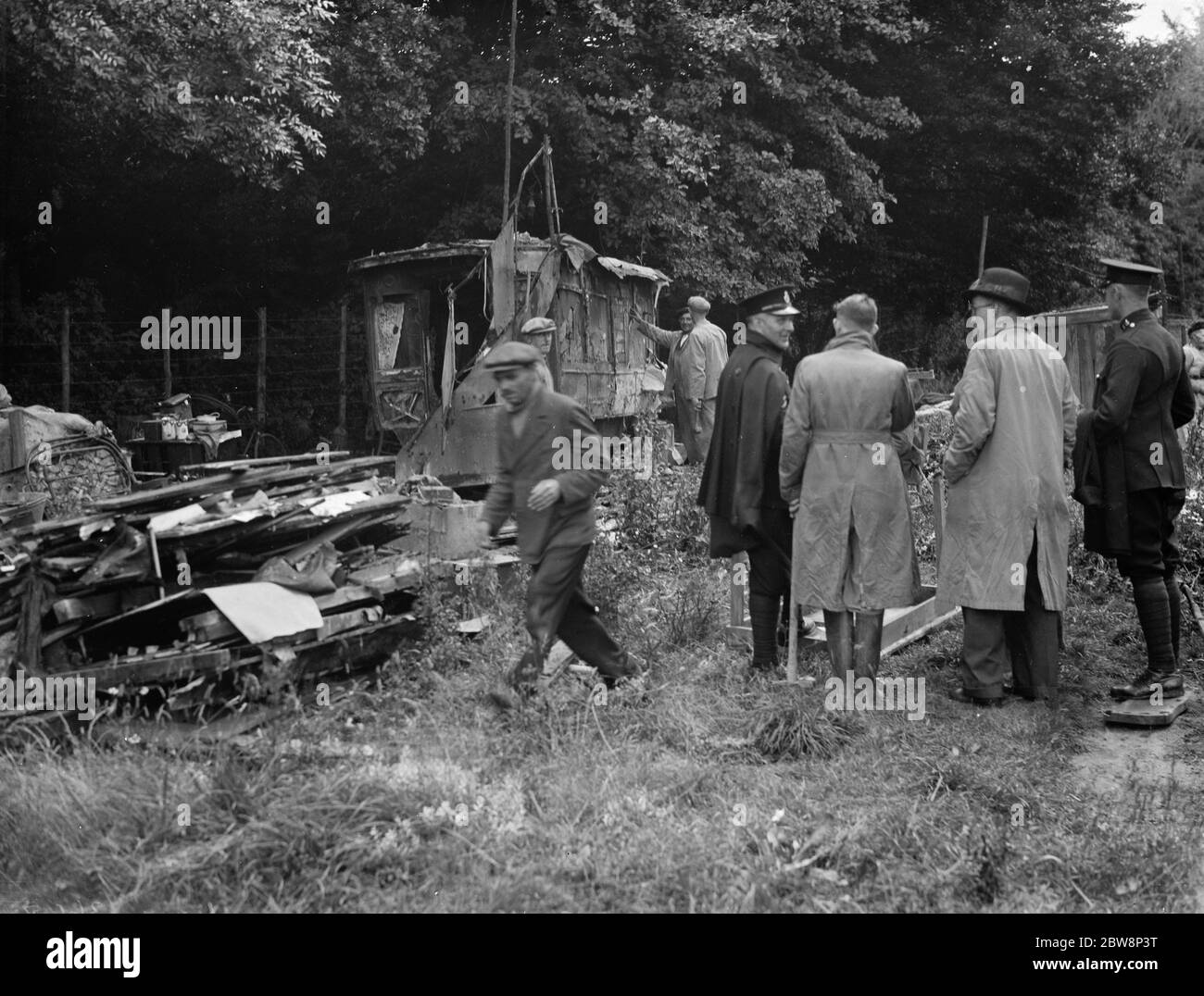 Watchers watch on as a shack in Kingsdown is demolished . 1936 Stock Photo