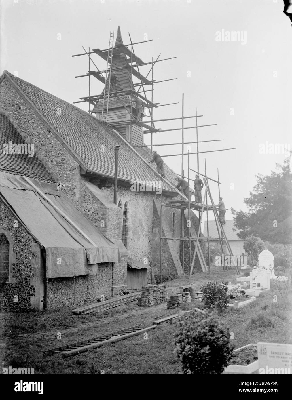 Repairing the roof and spire at Hartley Parish Church in Foots Cray , Kent 1937 Stock Photo