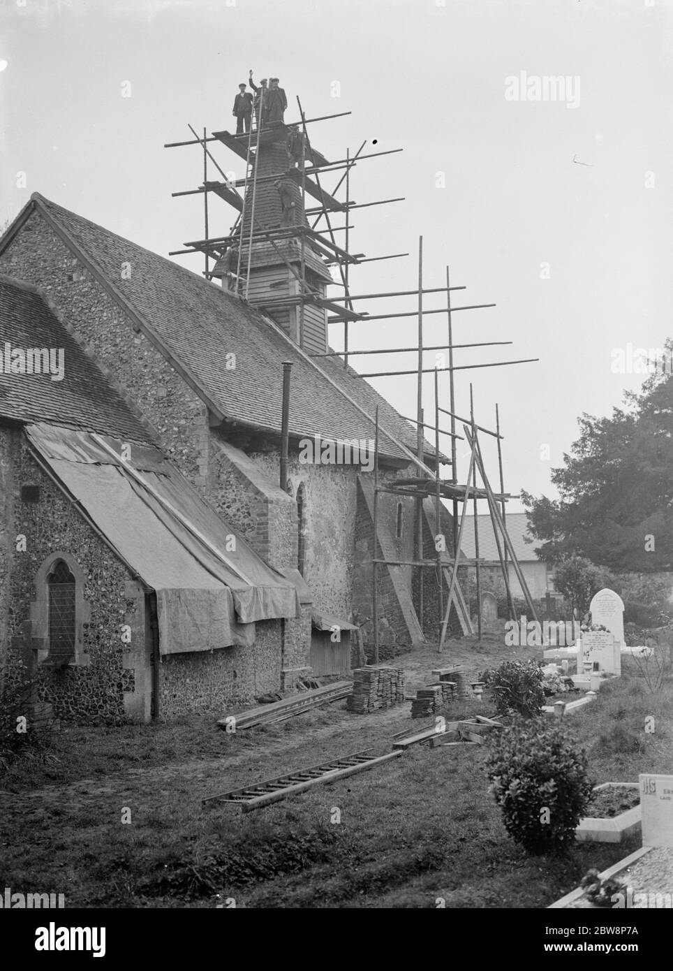 Repairing the roof and spire at Hartley Parish Church in Foots Cray , Kent 1937 Stock Photo