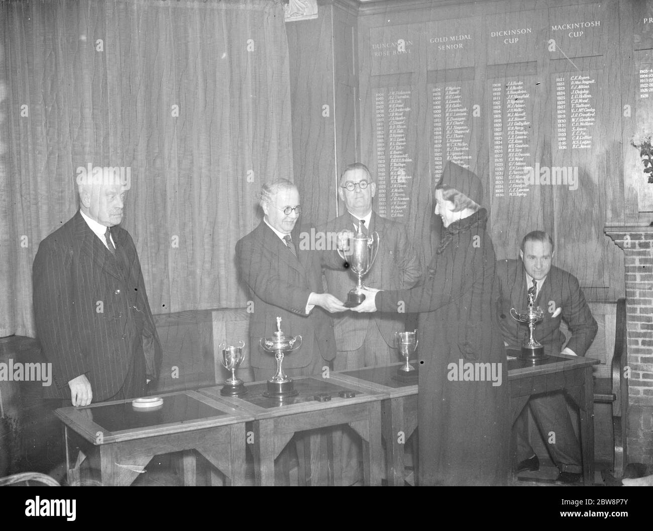Shooters Hill Golf Club presentations . Left to right ; Sir Kingsley Wood , Mayor of Woolwich , P H Rance and Miss B Abbey receiving her trophy . 1937 Stock Photo