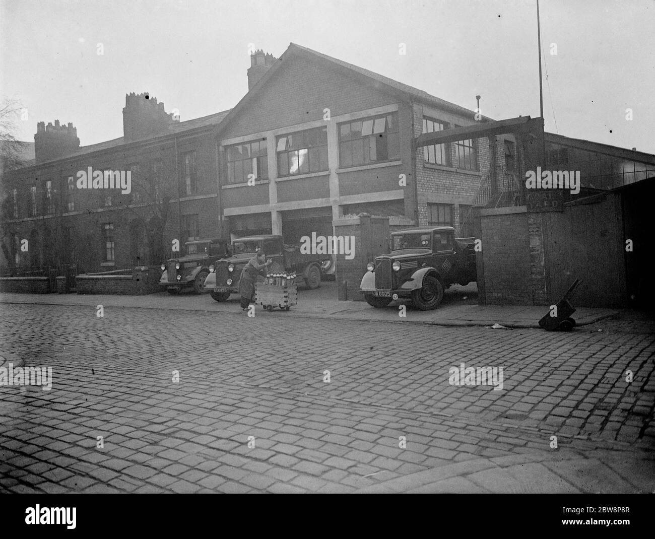 The exterior of The Condensed Gas Company with lorries parked in front , Manchester . 1937 . Stock Photo