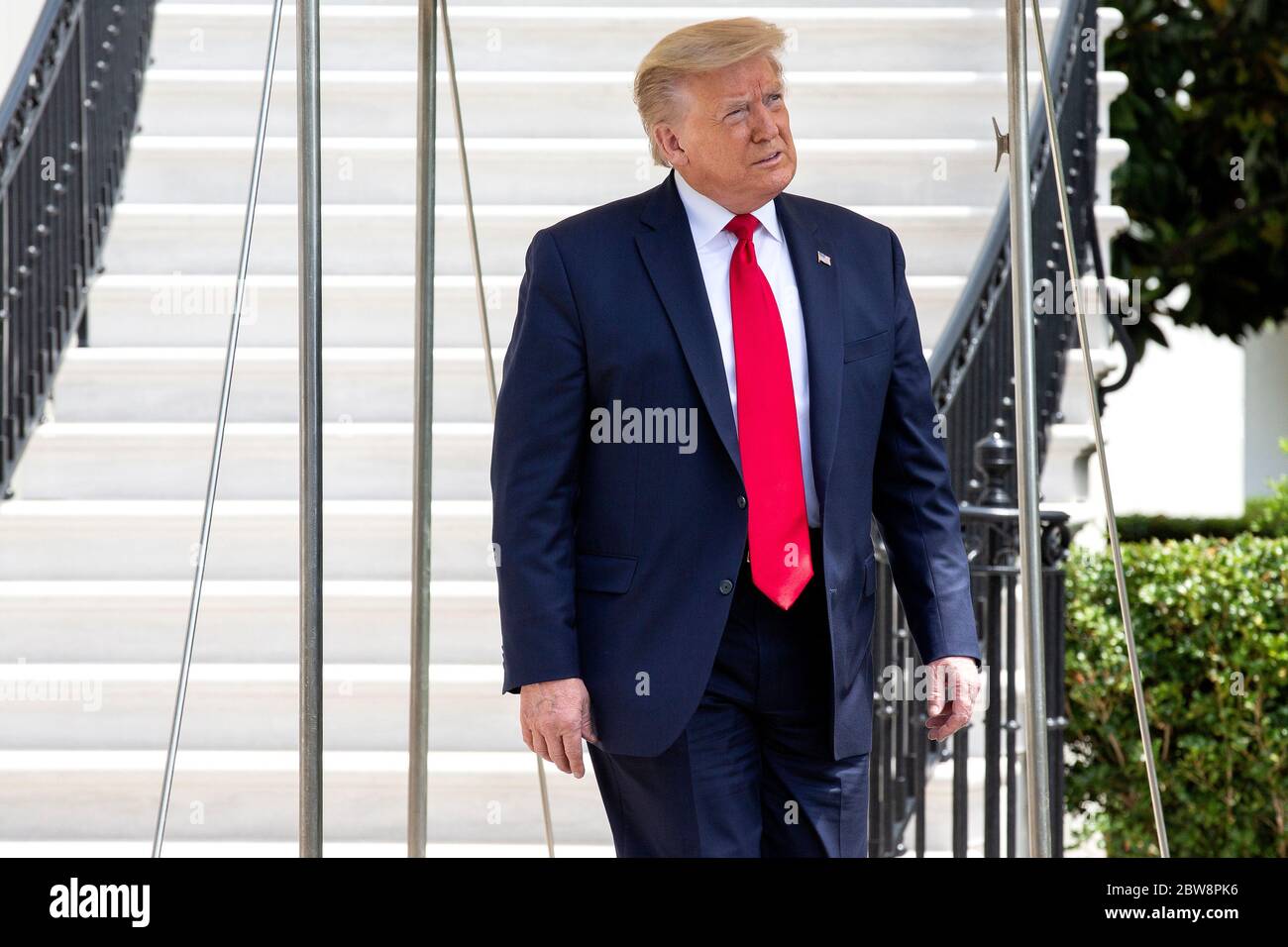 Washington, DC, USA. 30th May, 2020. United States President Donald J. Trump departs the White House in Washington, DC, U.S., on Saturday, May 30, 2020. Trump has used Twitter to criticize protests prompted by the death of George Floyd, as well as the response of Democratic leaders, after demonstrators clashed with Secret Service agents outside the White House last night. Credit: Stefani Reynolds/Pool via CNP | usage worldwide Credit: dpa/Alamy Live News Stock Photo