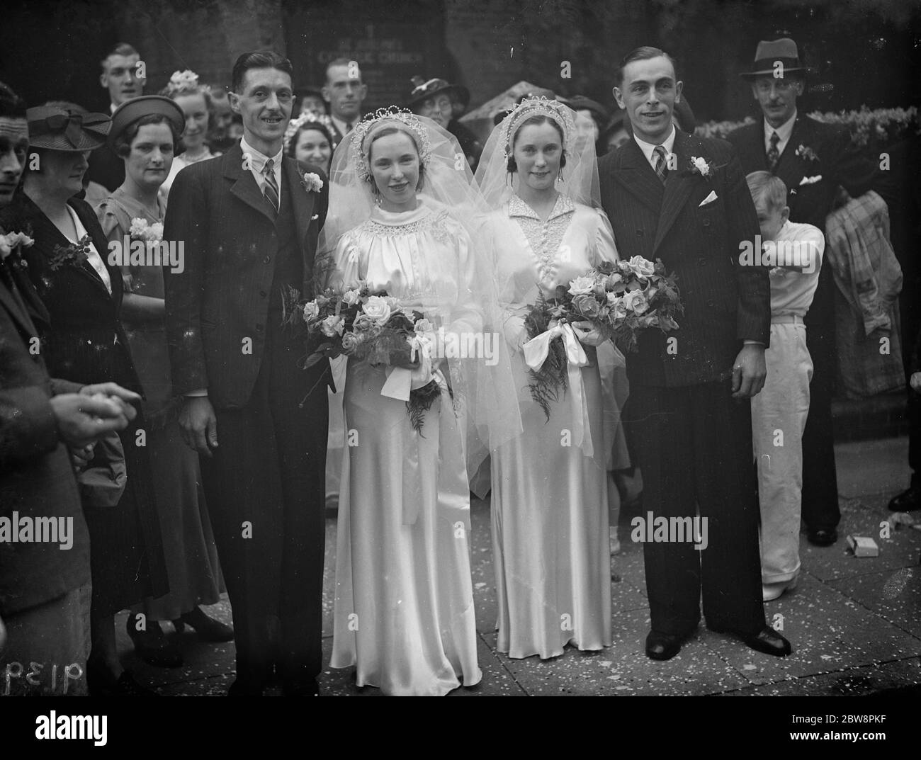The double wedding of the O ' Brian sisters . The marriages of Mr W T Johnson and Miss A O ' Brian and Mr R H Clark and Miss E O ' Brian . July 1938 Stock Photo