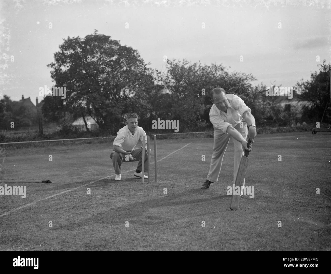 Charlton cricketers at New Eltham . A batsman and wicket keeper pose for a shot . 1938 Stock Photo