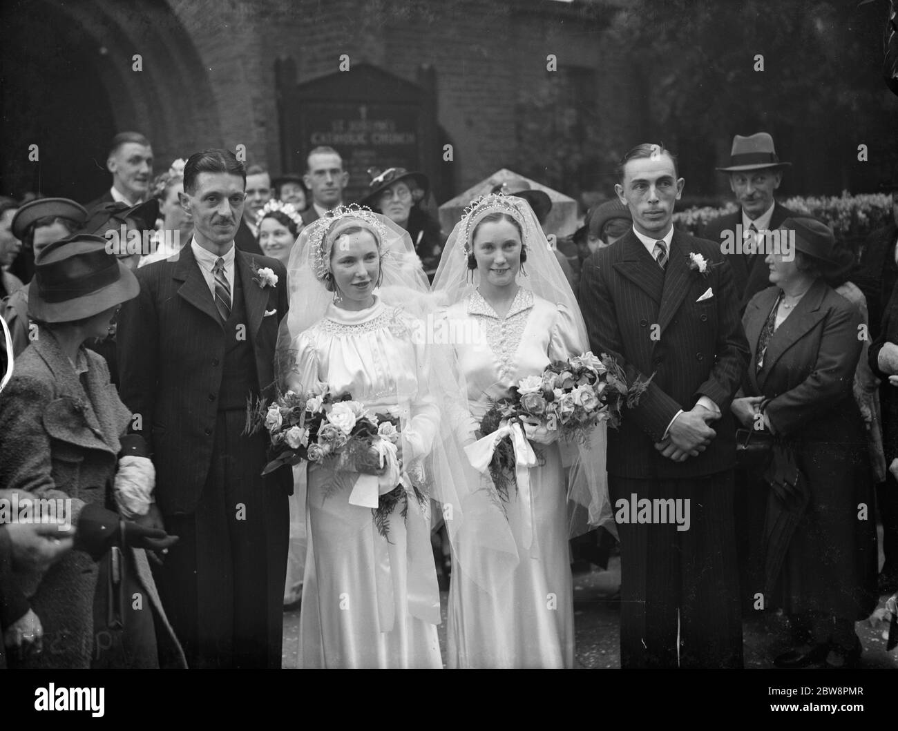 The double wedding of the O ' Brian sisters . The marriages of Mr W T Johnson and Miss A O ' Brian and Mr R H Clark and Miss E O ' Brian . July 1938 Stock Photo