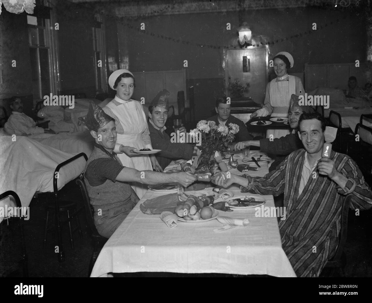 Christmas dinner for the patients at the County Hospital in Dartford , Kent . 1937 Stock Photo