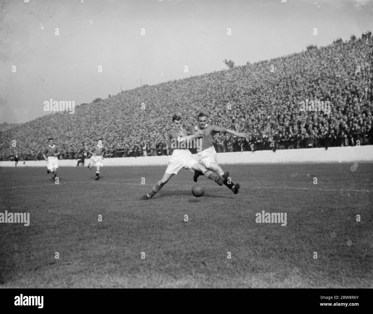 Charlton Athletic Football Club ; two players compete for the ball . 1936 Stock Photo