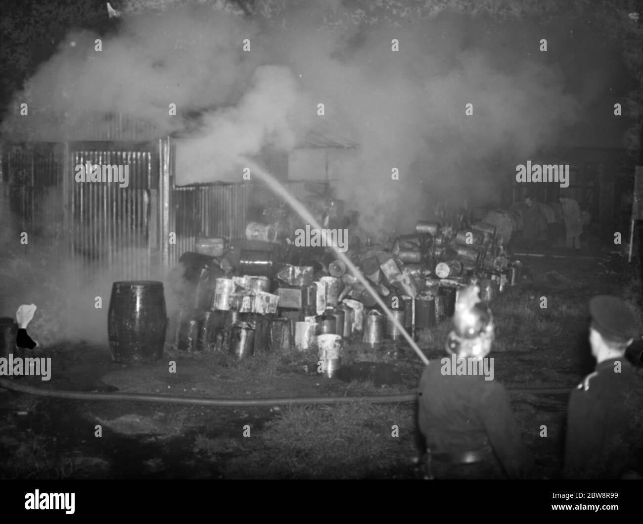 Firefighters attending a fire at the paint factory in Foots Cray . 1938 Stock Photo