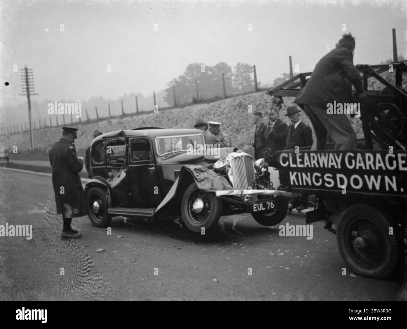 Car crash at Gorse Hill in Farningham . Damaged car is being towed away 30 August 1938 Stock Photo