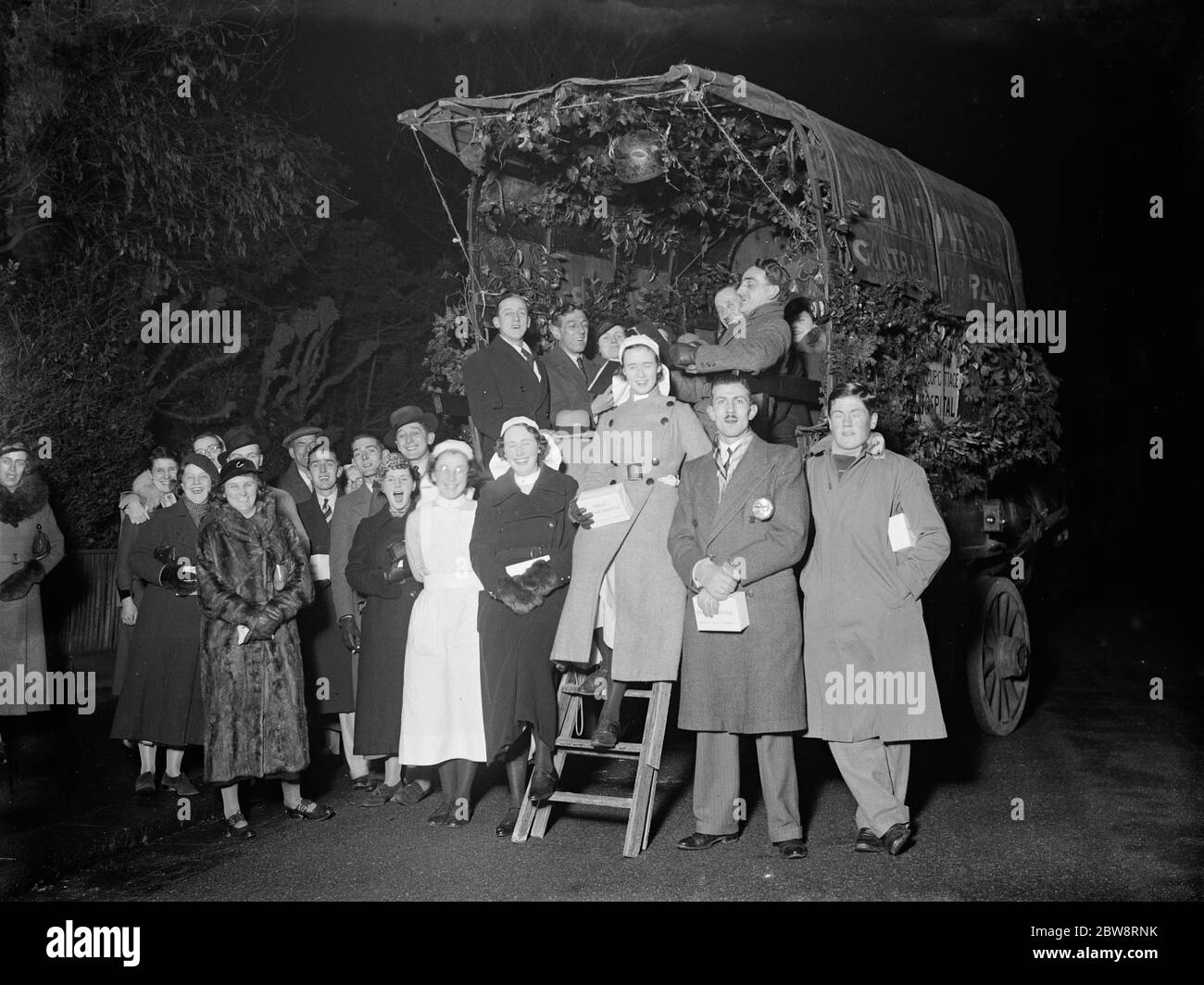 Sidcup Cottage Hospital carol singers with their wagon . 1935 Stock Photo