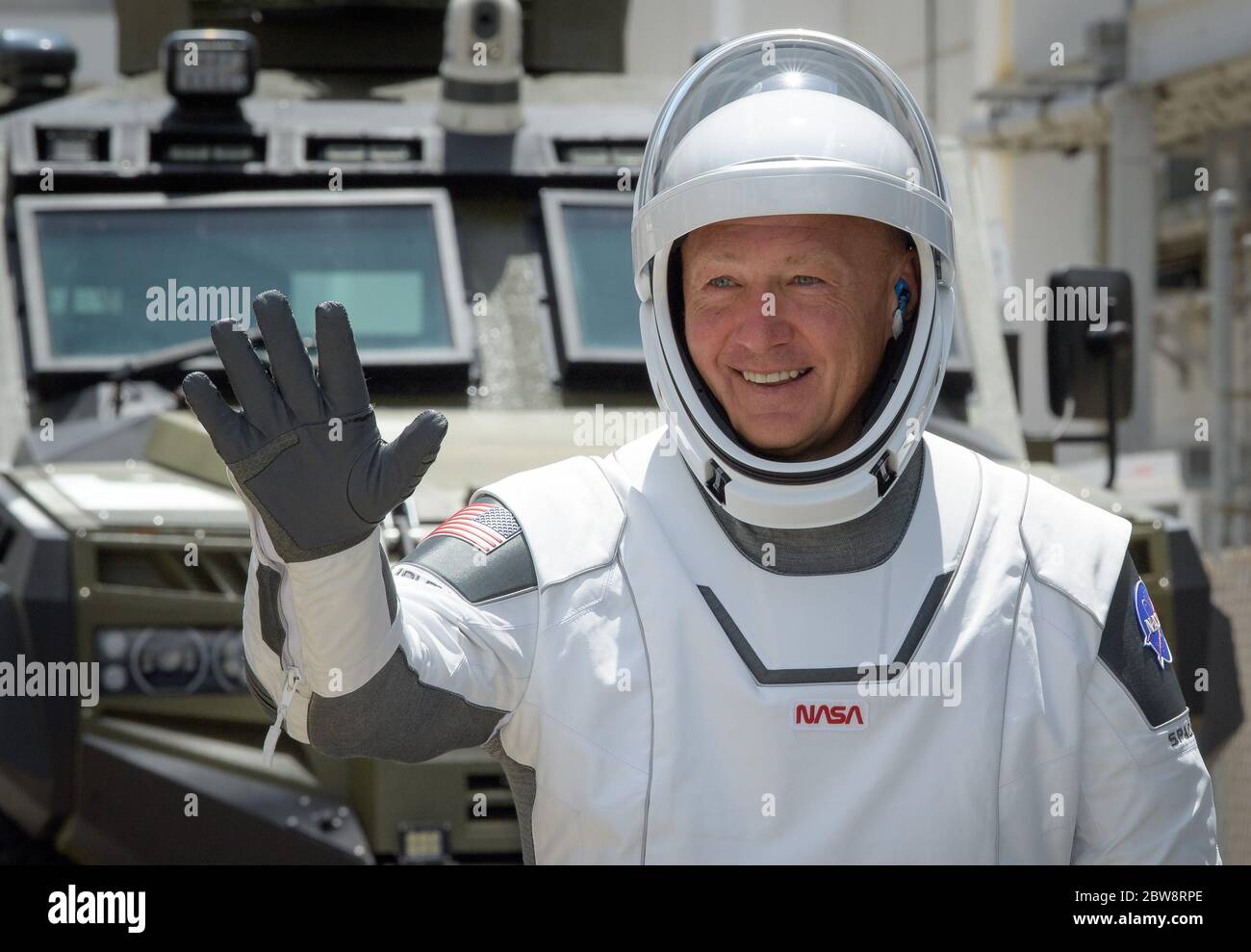 (200530) -- CAPE CANAVERAL (U.S.), May 30, 2020 (Xinhua) -- NASA astronaut Doug Hurley waves as he and Bob Behnken depart for Launch Complex 39A at NASA's Kennedy Space Center in Florida, the United States, May 30, 2020. NASA and SpaceX launched Crew Dragon spacecraft from NASA's Kennedy Space Center in Florida on Saturday, carrying two American astronauts to the International Space Station (ISS). (Bill Ingalls/NASA/Handout via Xinhua) Stock Photo