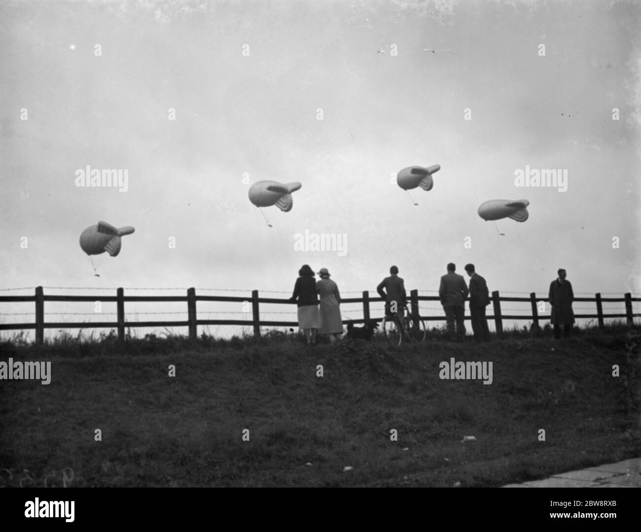 Air Minister Sir Kingsley Wood opens the first barrage balloon squadron site in Kidbrooke , London where practice balloons were brought out from the hangars . General view of the balloons . 6 September 1938 Stock Photo