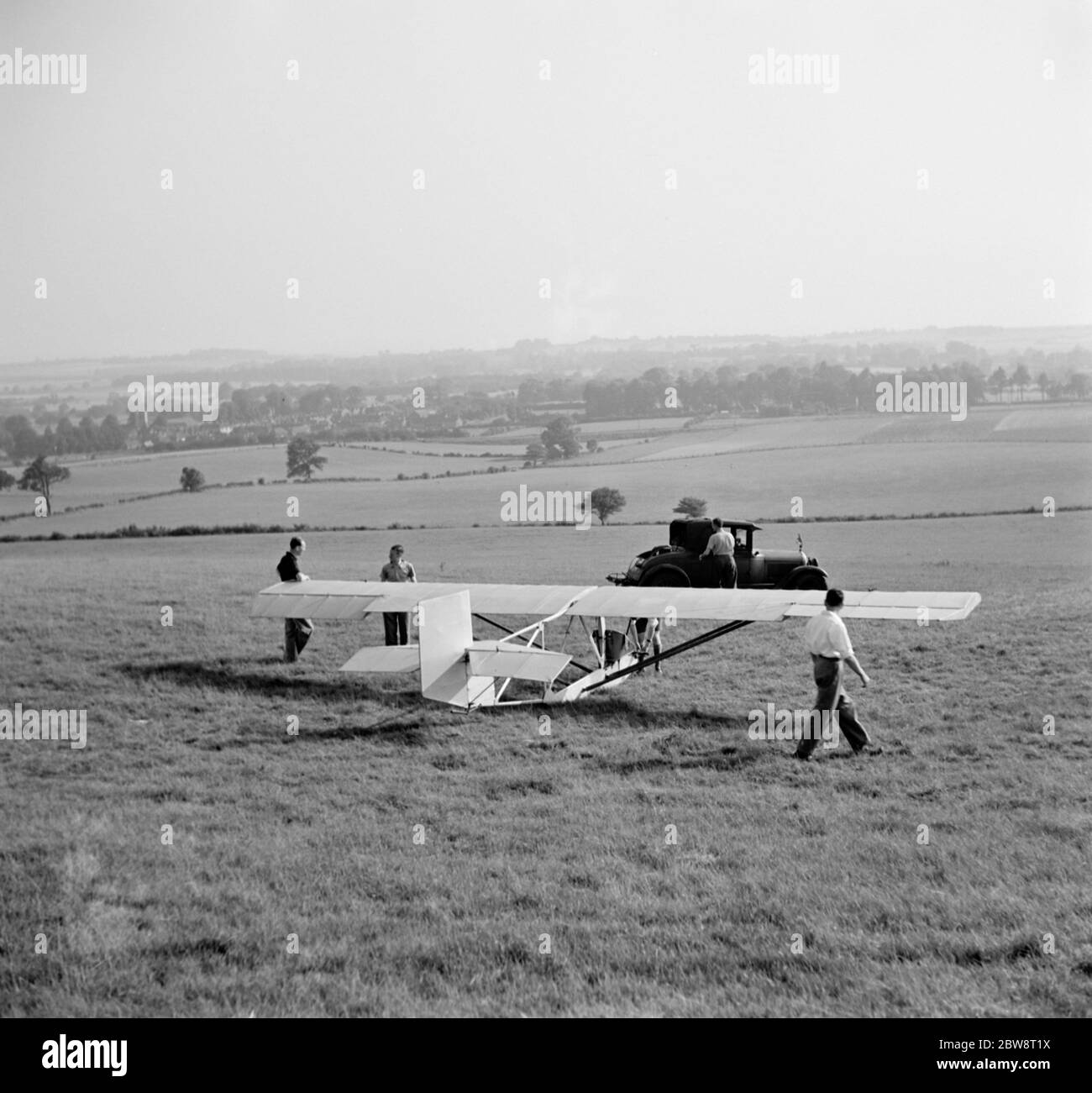 A Cessna CG-2 Glider is being hitched up to its tow line , in preperation for its launch in Lenham , Kent . 1936 . Stock Photo