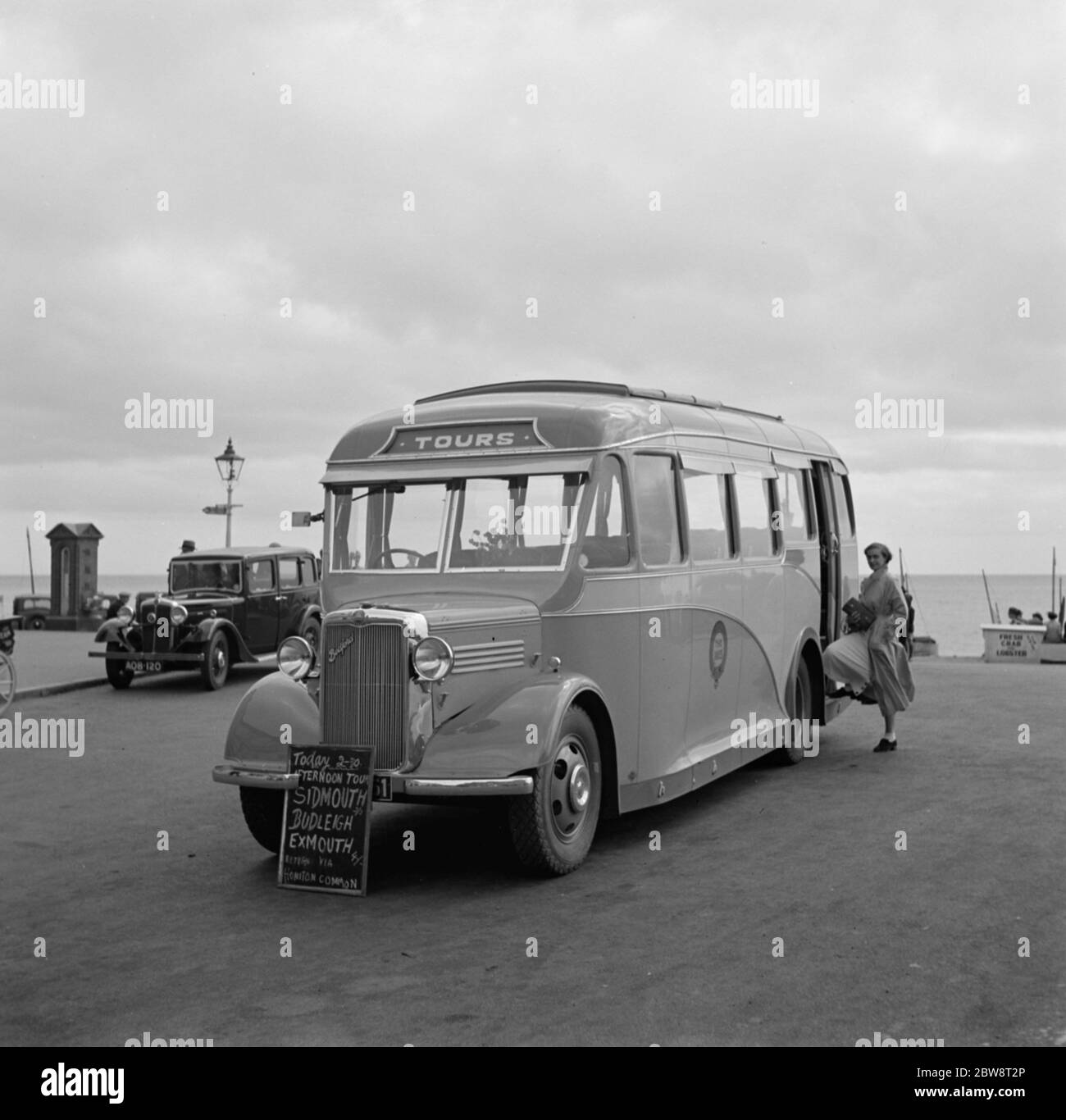 Swanage tour coache on the sea front in Swanage , Dorset . 1936 Stock Photo