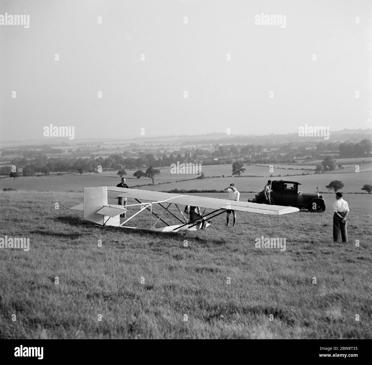 A Cessna CG-2 Glider is being hitched up to its tow line , in preperation for its launch in Lenham , Kent . 1936 . Stock Photo
