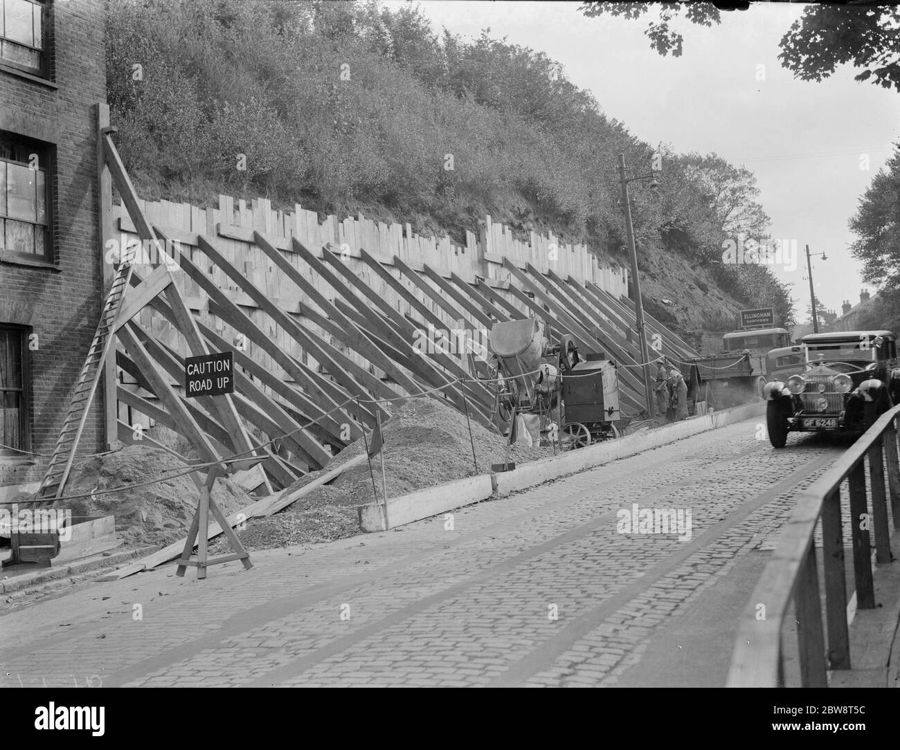 Shoring up a landslide with wooden braces in Dartford , Kent . 1938 Stock Photo