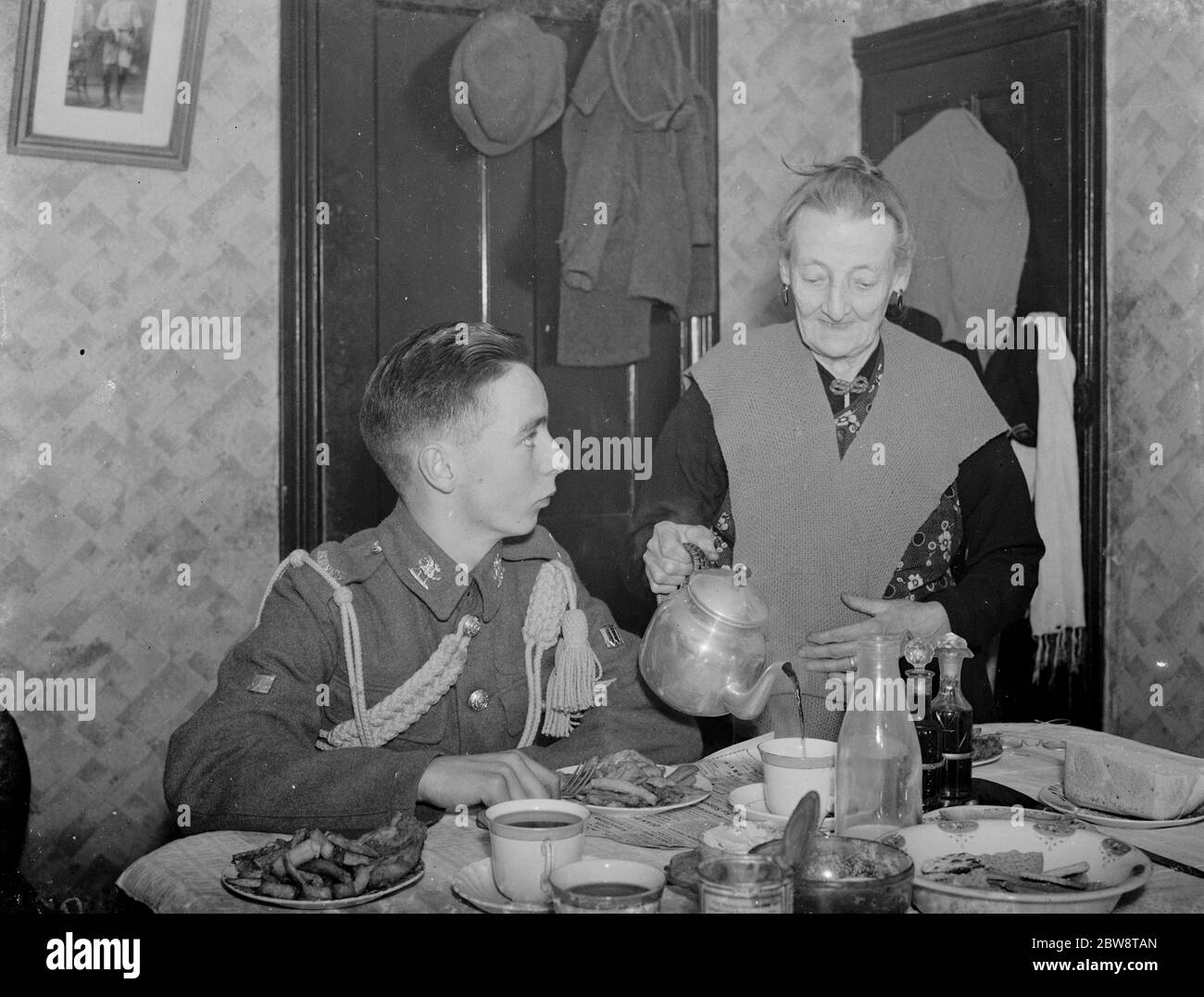 Harry Bassam the drummer boy with Granny Welling . 1938 Stock Photo