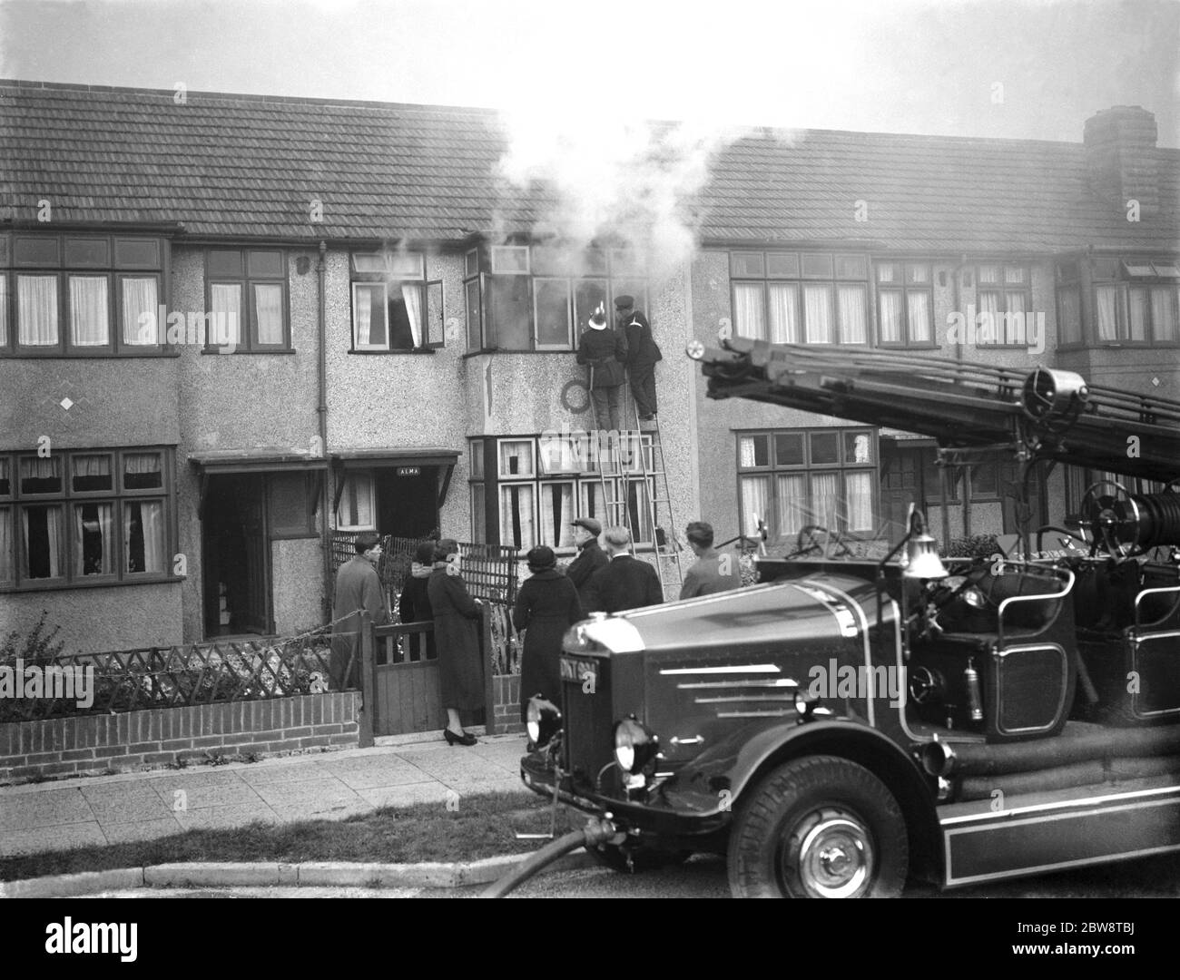 Firemen tend to a fire at ' Alma ' house on Old Farm Avenue in Sidcup