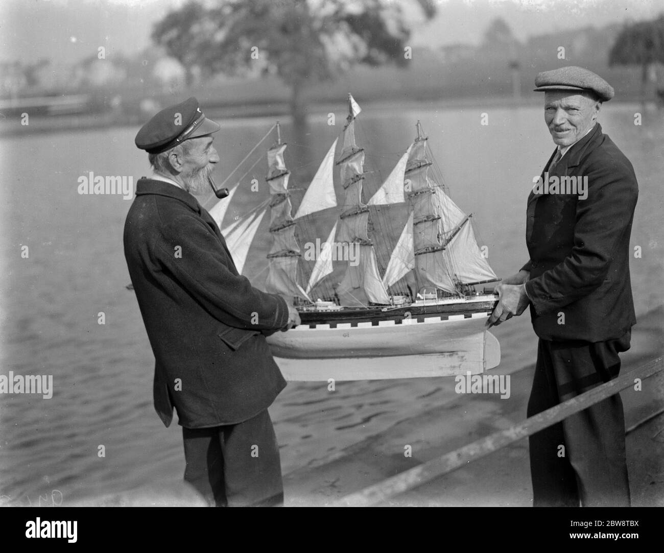 Captain J F Dean and R Stead with a model sailing ship in Blackheath , London . 1938 Stock Photo