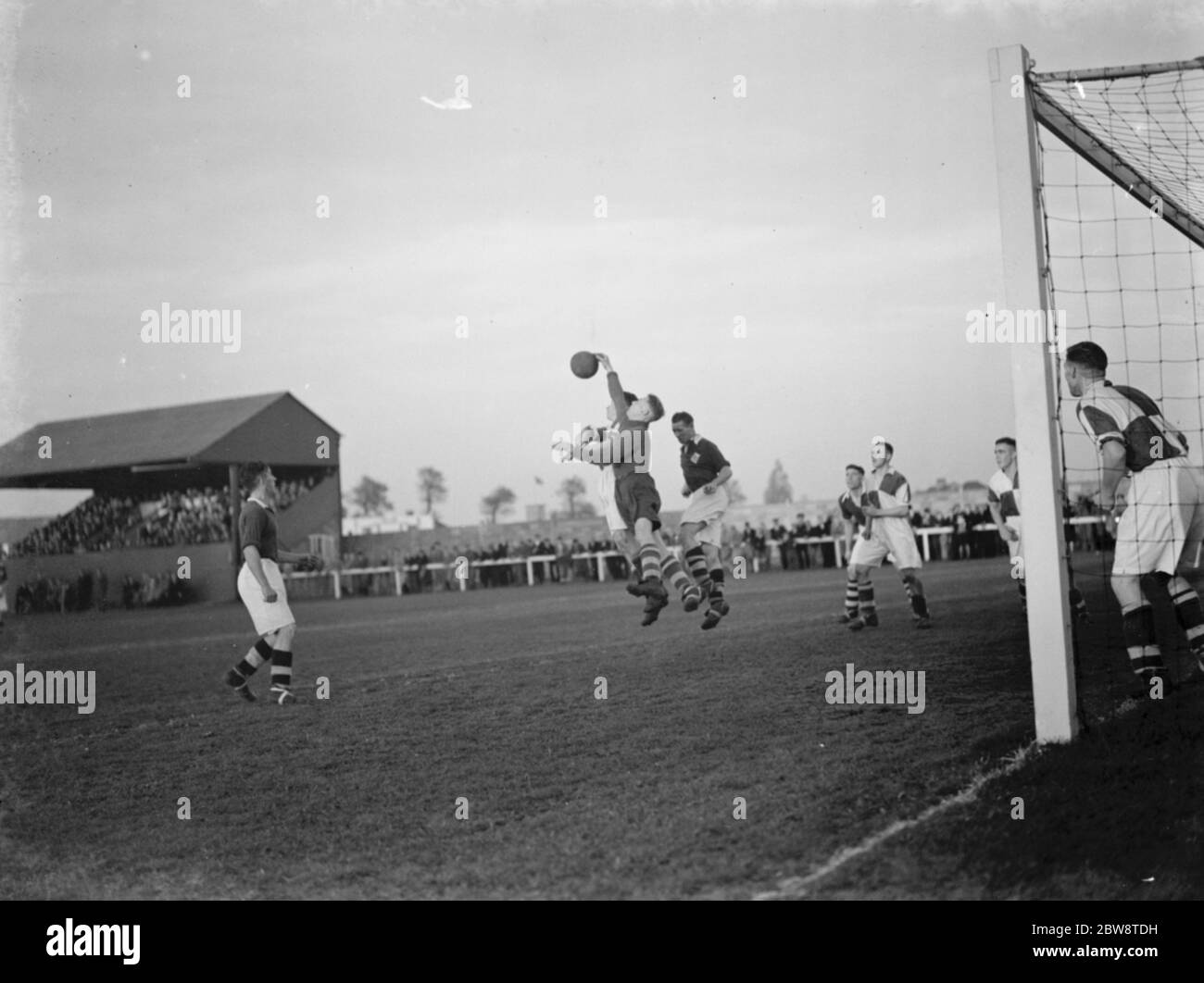 London Paper Mills vs. Erith and Belvedere - Kent League - 05/11/38 Goalkeeper comes out to collect the ball . 1938 Stock Photo