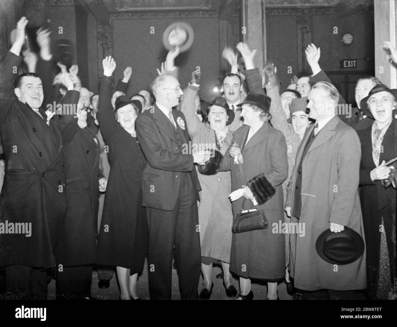 On winning the Dartford by - election , Mrs Janet ' Jennie ' Adamson , Labour Party candidate shakes the hand of her opponent , Conservative Party candidate , Mr Geoffrey Mitchell . 1938 Stock Photo