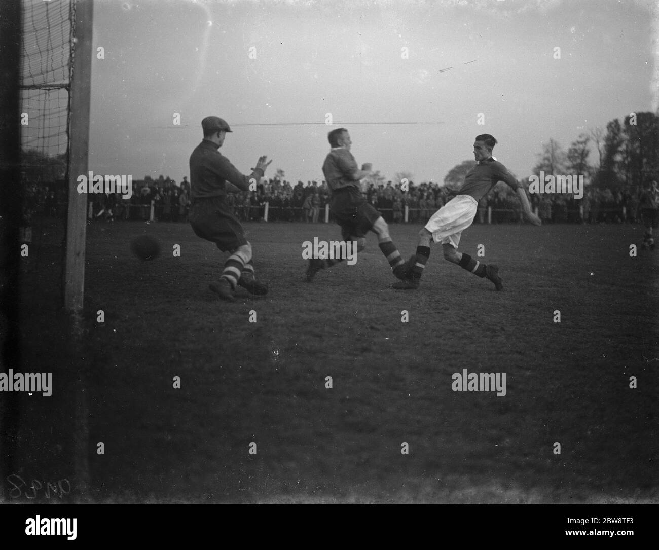 Bexleyheath and Welling vs. Dartford reserves - Kent League - 22/10/38 Two players compete for the ball . 1938 Stock Photo