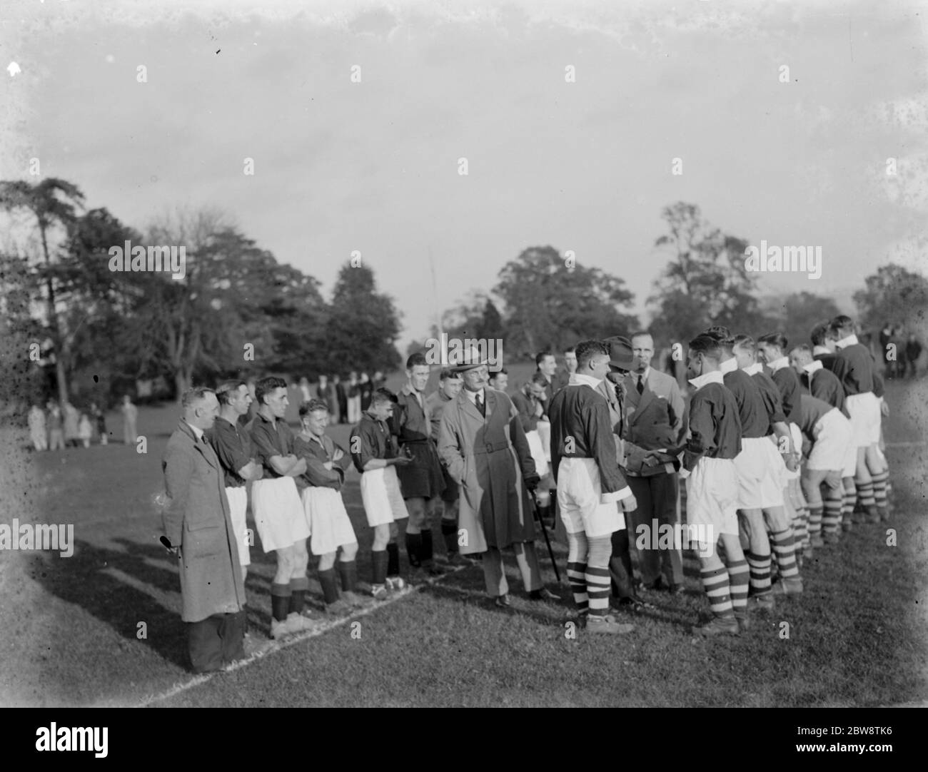 Sidcup councilers shake the hands of footballers at a match . 1936 Stock Photo