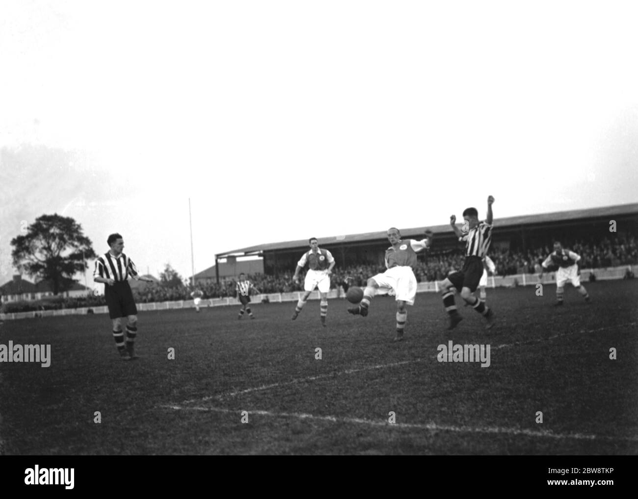 Dartford vs. Ipswich Town - Southern League - 24/10/36 Two players compete for the ball in the box . 1936 Stock Photo