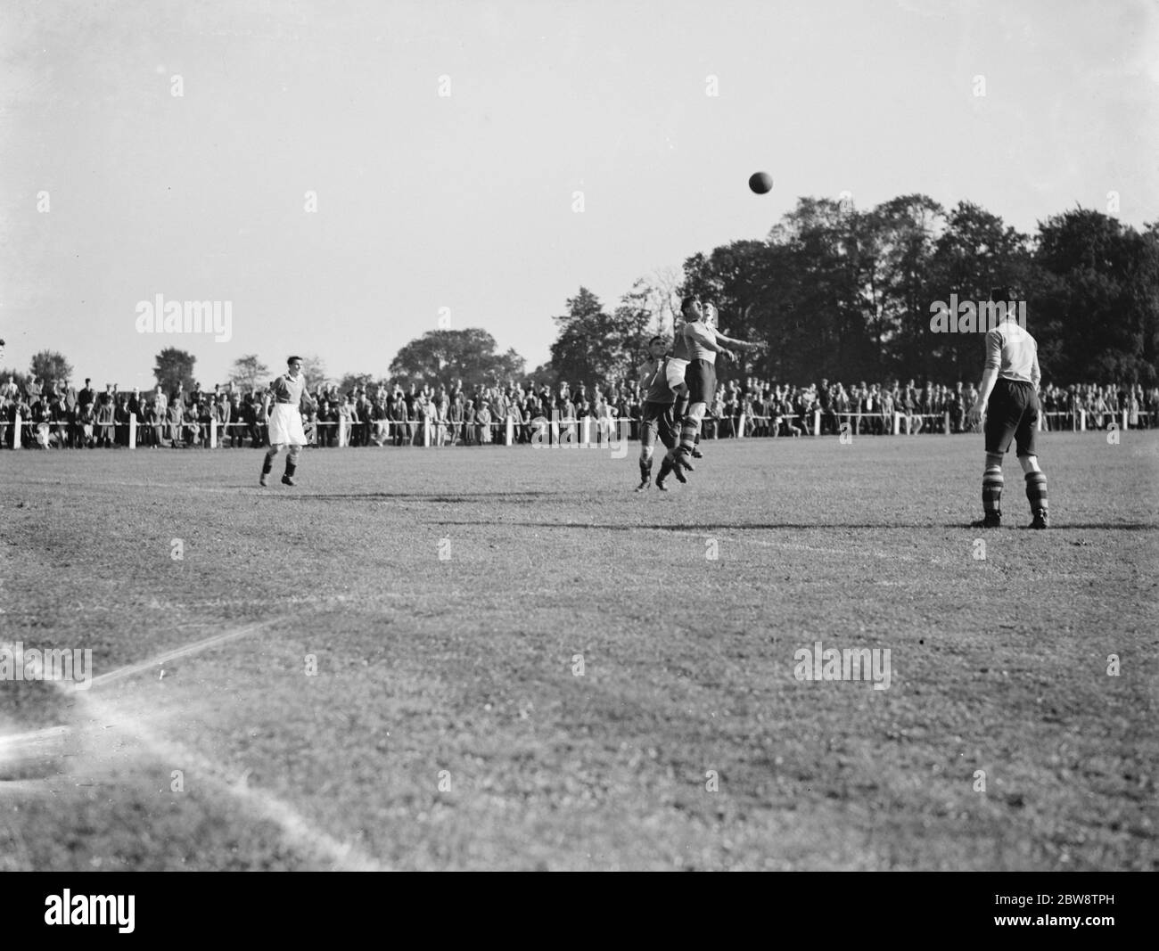 Football Match : Bexleyheath and Welling Football Club versus Swanley Football Club . Two players fight for an arial ball . 3 October 1938 Stock Photo