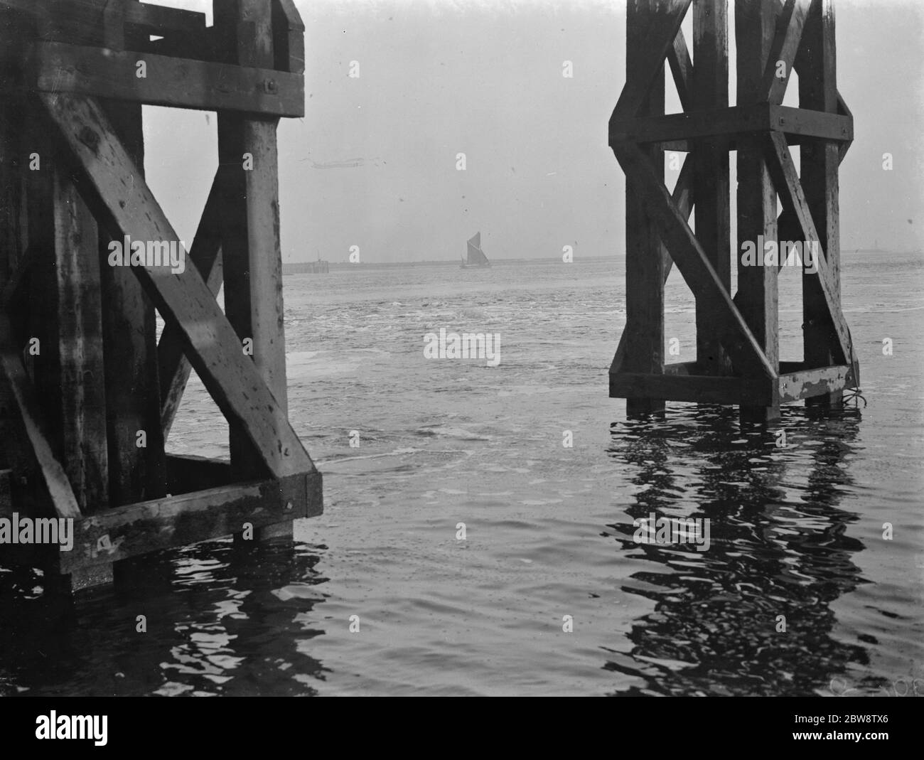 The construction of the Dartford Tunnel , where recently a pilot tunnel was completed . Air bubbles are appearing on the river Thames above where the tunneling is taking place . 1938 Stock Photo