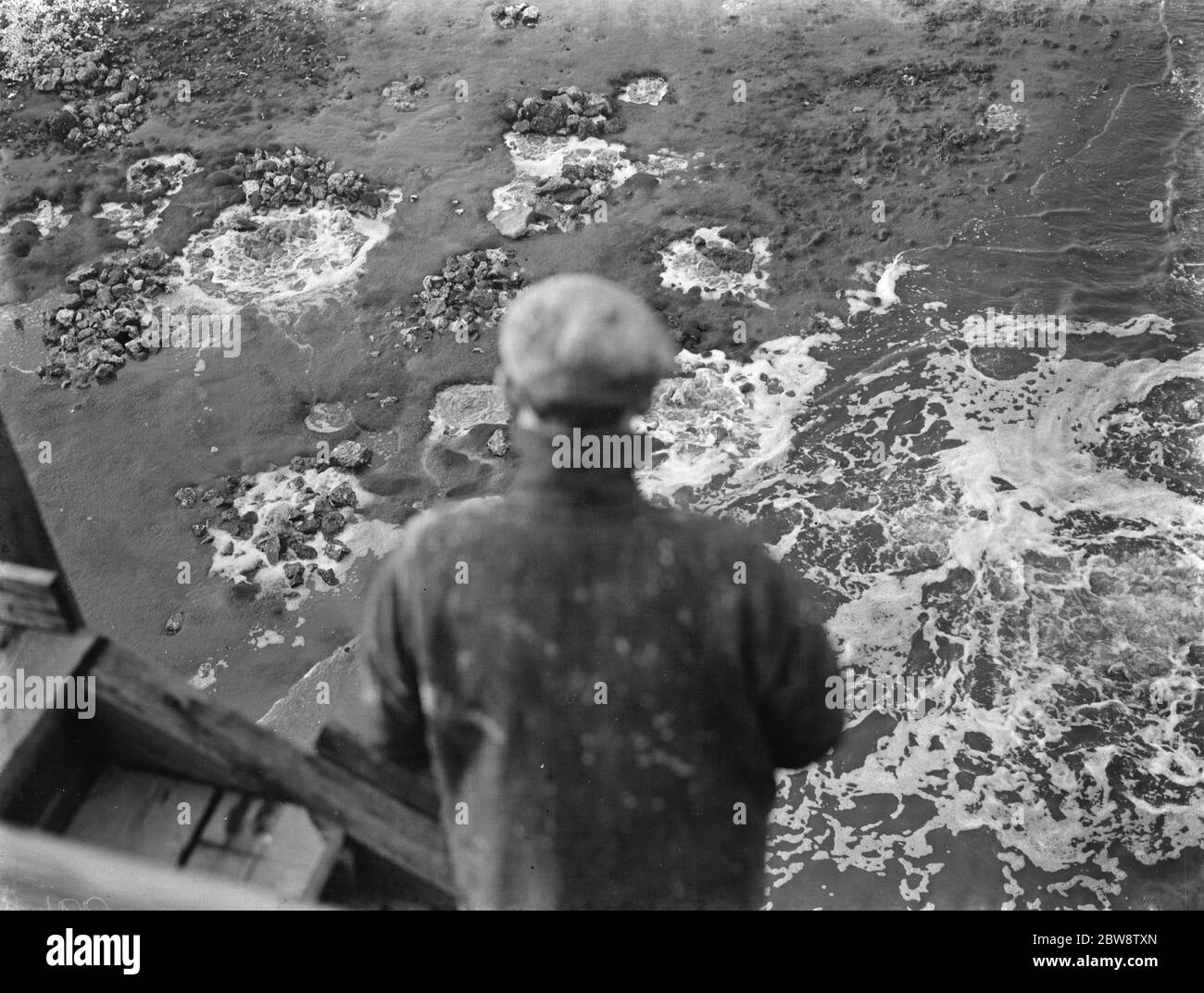 The construction of the Dartford Tunnel , where recently a pilot tunnel was completed . Air bubbles are appearing on the river Thames above where the tunneling is taking place . 1938 Stock Photo
