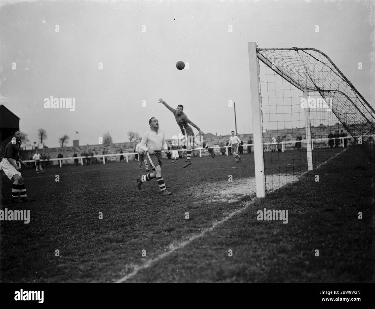 London Paper Mills vs. Finchley - FA Amateur Cup - 05/11/38 The goalkeeper makes a leap for the ball . 1938 Stock Photo