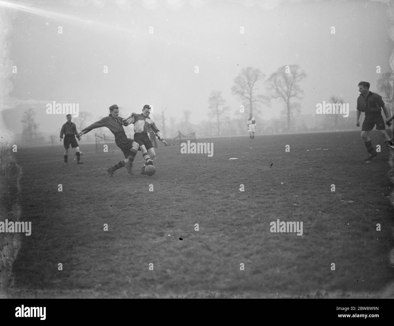 Football match in the Challange Cup . London versus the Southampton Methodists . Players compete for the ball . 1938 Stock Photo