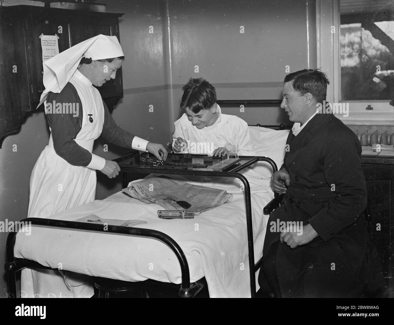 Christmas at the County Hospital in Dartford , Kent . Patients play dominoes . 25 December 1938 Stock Photo