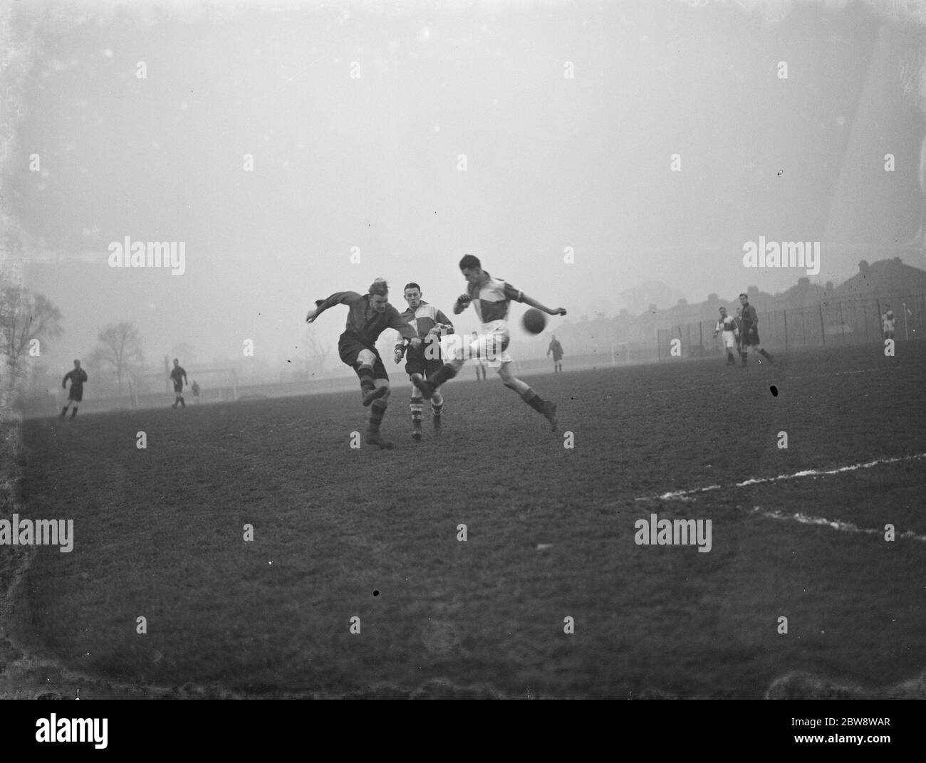 Football match in the Challange Cup . London versus the Southampton Methodists . Players compete for the ball . 1938 Stock Photo